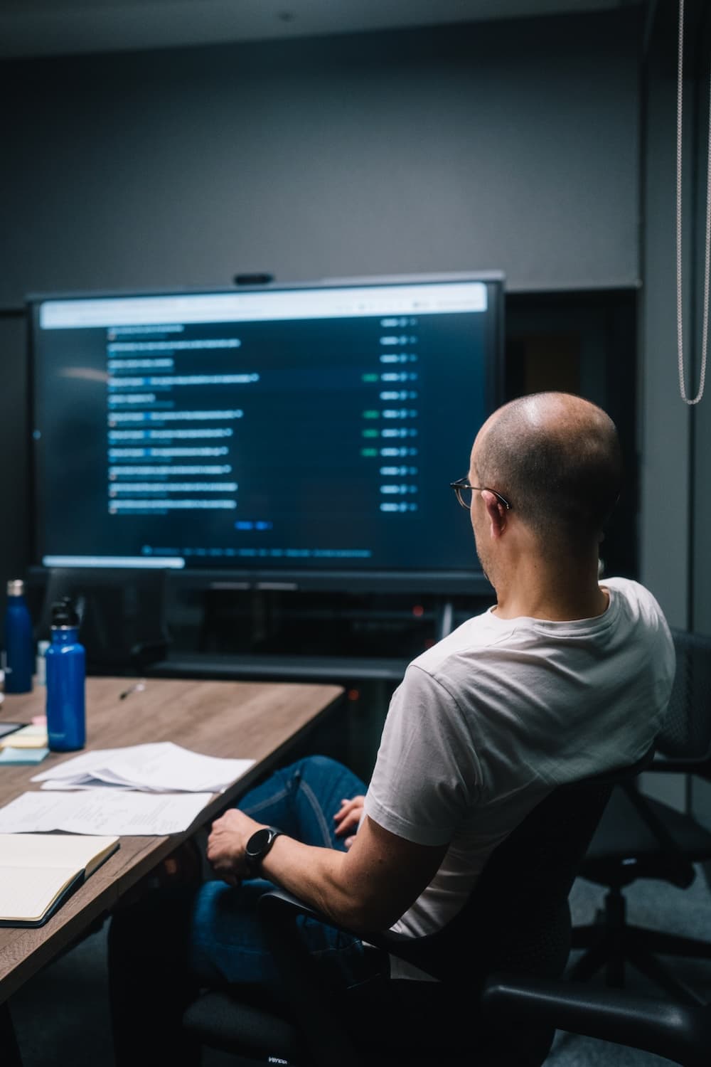Engineer reviewing structured technical output on a large screen