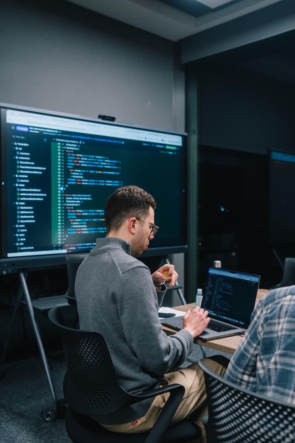 Engineer reviewing code during a collaborative technical session
