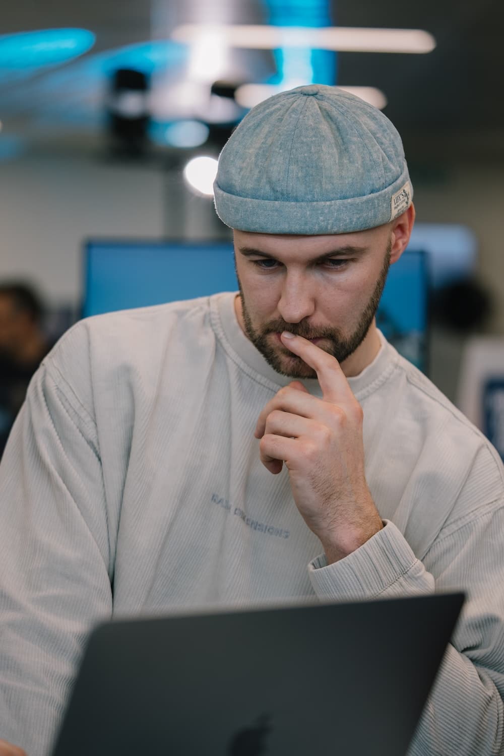 Software engineer concentrating on technical work at a laptop