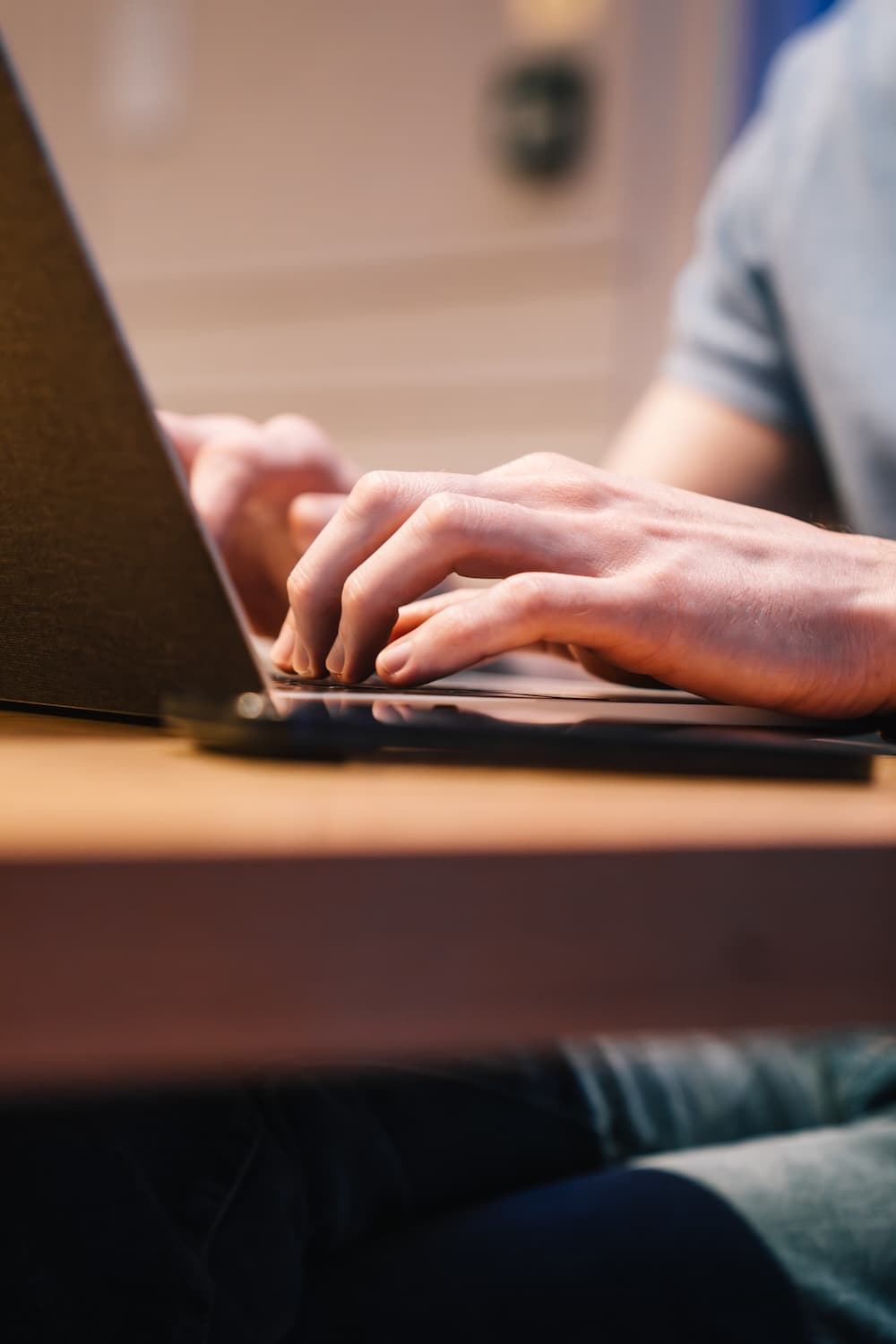 Software developer typing on a laptop